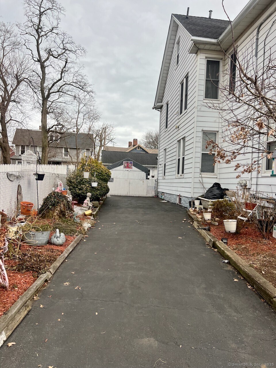 185 Cottage St, Bridgeport, CT 06605 - view of side of property featuring fence