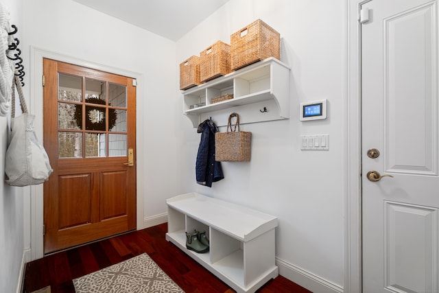 mudroom with baseboards and wood finished floors