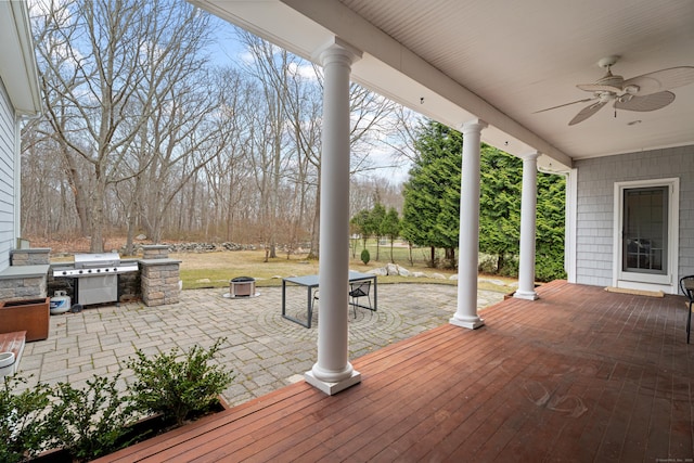 wooden terrace featuring a patio, ceiling fan, and area for grilling