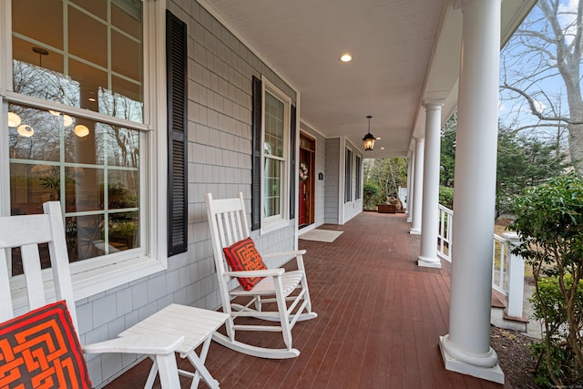 wooden terrace featuring covered porch