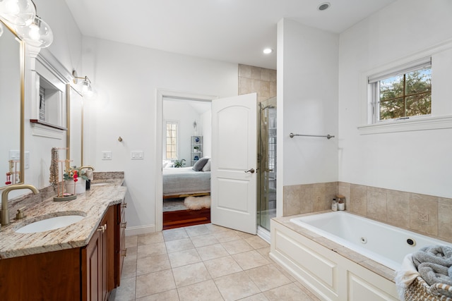 ensuite bathroom with ensuite bath, vanity, a wealth of natural light, and a shower stall