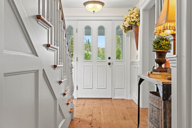 1 Hathaway Rd, East Lyme, CT 06333 - foyer featuring light wood finished floors, stairway, and crown molding
