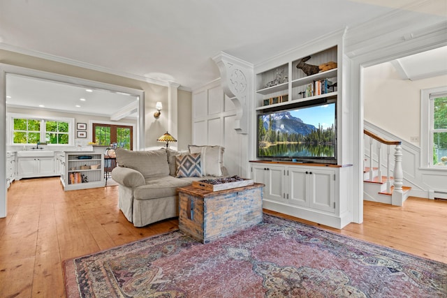 1 Hathaway Rd, East Lyme, CT 06333 - living area featuring light wood-style floors, stairway, healthy amount of natural light, ornamental molding, and recessed lighting