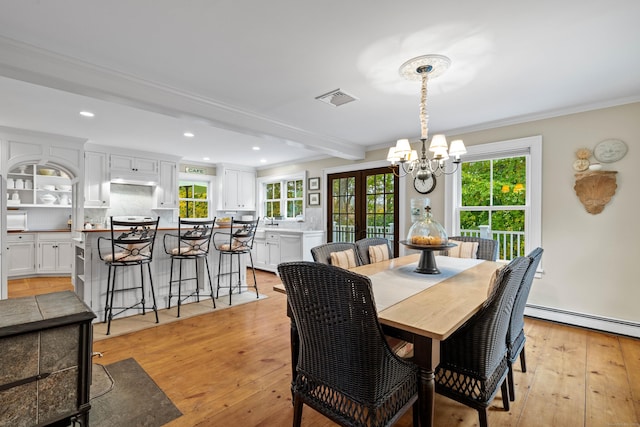 1 Hathaway Rd, East Lyme, CT 06333 - dining space featuring a baseboard heating unit, a chandelier, light wood-type flooring, crown molding, and recessed lighting