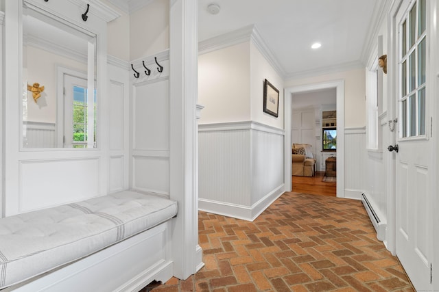 1 Hathaway Rd, East Lyme, CT 06333 - mudroom with a baseboard radiator, brick flooring, wainscoting, ornamental molding, and a decorative wall