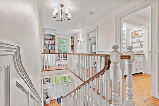 1 Hathaway Rd, East Lyme, CT 06333 - stairway with wood finished floors, ornamental molding, attic access, and a chandelier