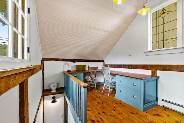 1 Hathaway Rd, East Lyme, CT 06333 - unfurnished office with a baseboard radiator, hardwood / wood-style flooring, built in desk, plenty of natural light, and lofted ceiling