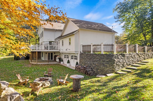 1 Hathaway Rd, East Lyme, CT 06333 - back of house with an outdoor fire pit, a deck, a patio, a garage, and french doors