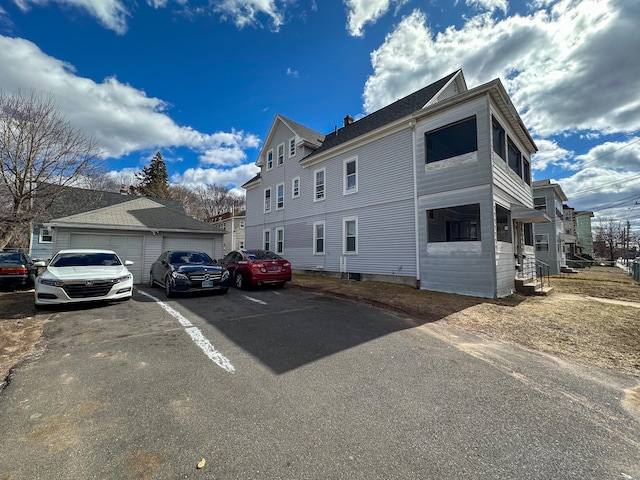 view of home's exterior featuring an outdoor structure