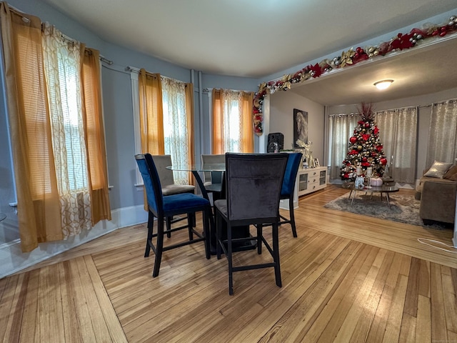 dining space featuring light wood-type flooring