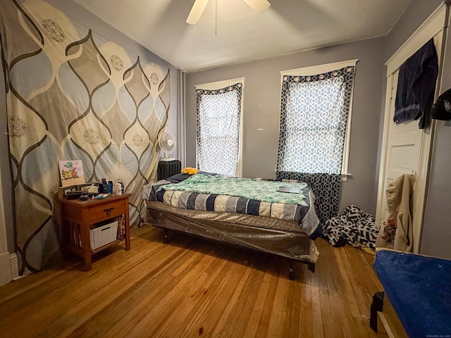 bedroom featuring ceiling fan and wood-type flooring