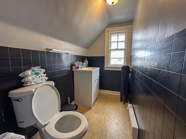 half bathroom with a wainscoted wall, toilet, vaulted ceiling, baseboard heating, and vanity