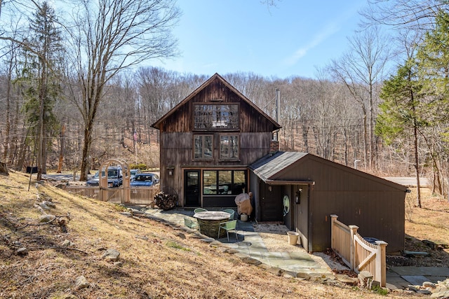 rear view of house with a forest view