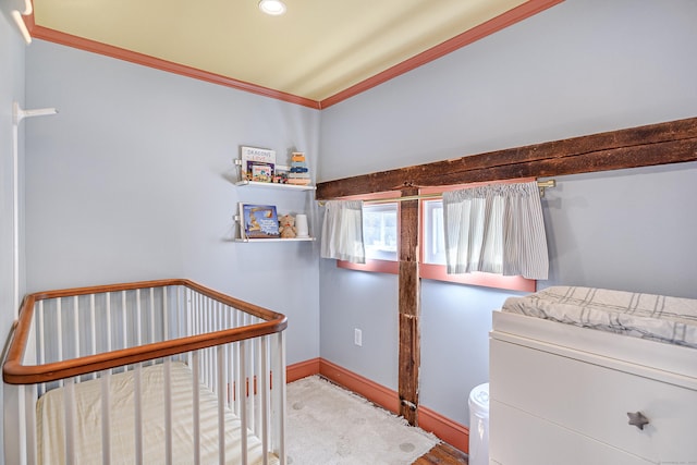 bedroom with baseboards and ornamental molding