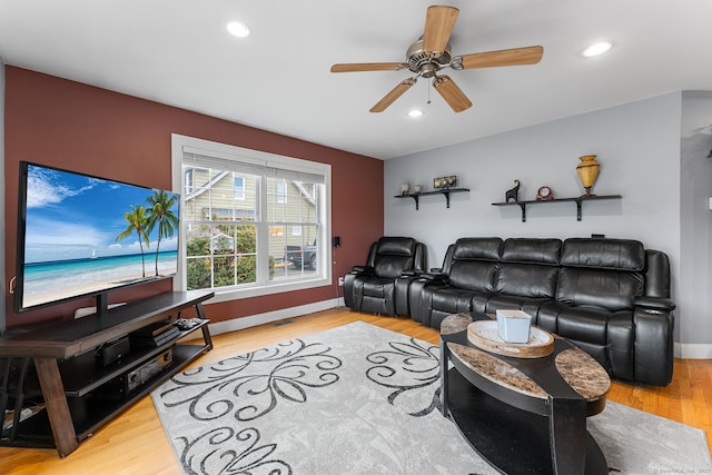 living area with a ceiling fan, recessed lighting, light wood-style floors, and baseboards