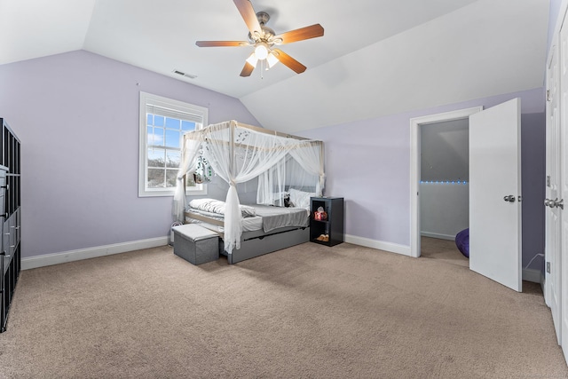 carpeted bedroom with lofted ceiling, baseboards, visible vents, and ceiling fan