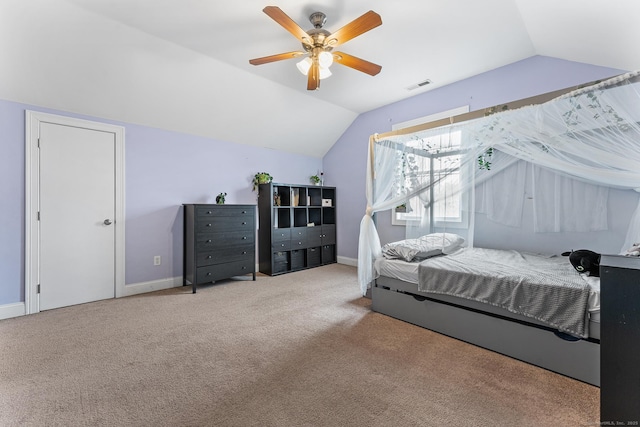 bedroom featuring visible vents, ceiling fan, baseboards, carpet, and lofted ceiling