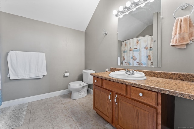 bathroom featuring tile patterned flooring, baseboards, toilet, lofted ceiling, and vanity