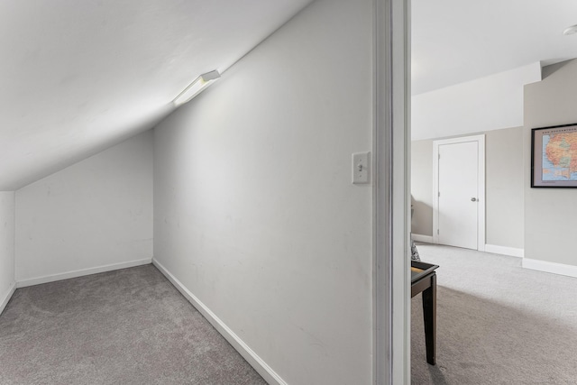 bonus room featuring baseboards, carpet floors, and lofted ceiling