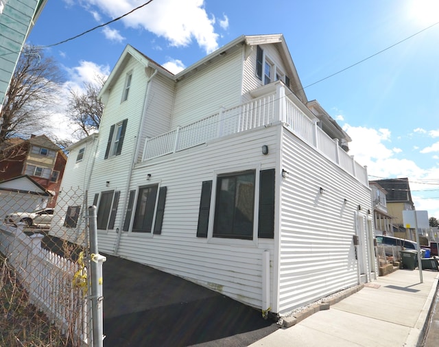 view of home's exterior featuring fence