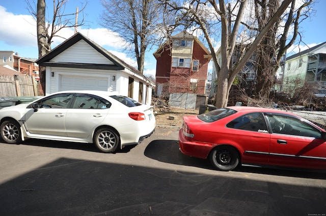 view of front of home with fence and a garage