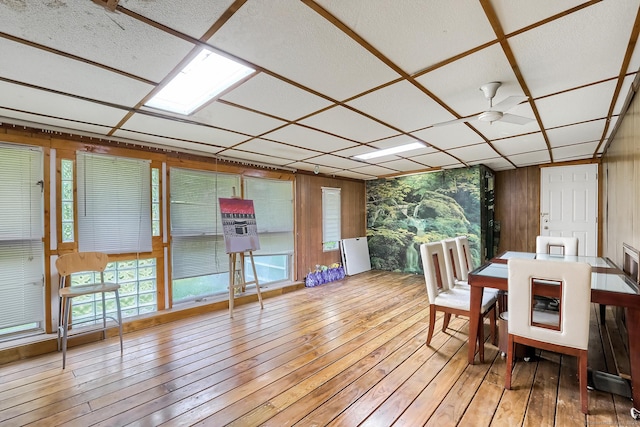 sunroom featuring ceiling fan and a paneled ceiling