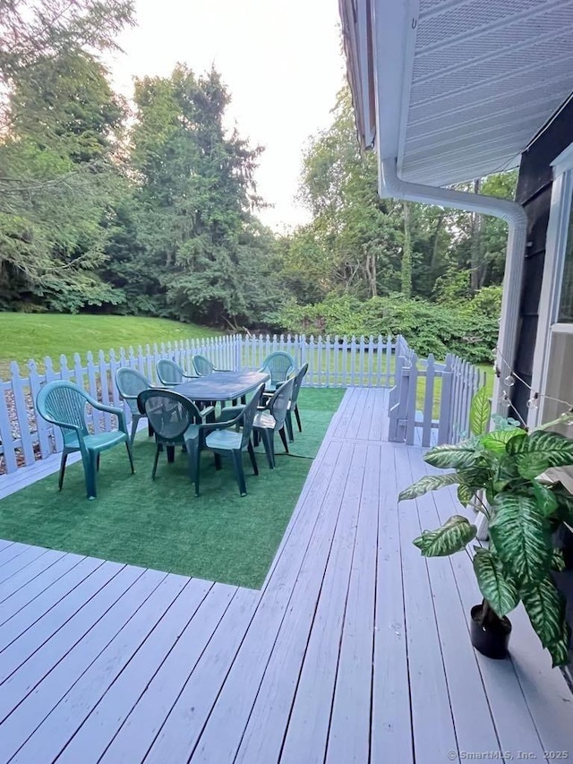 deck with outdoor dining area