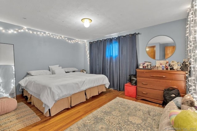 bedroom with wood finished floors