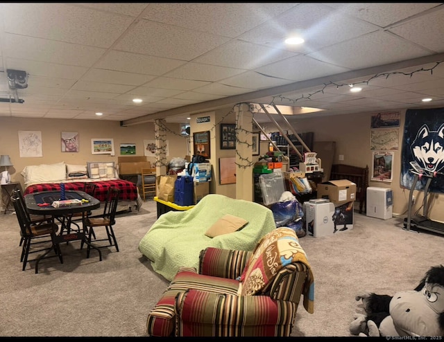 interior space featuring a drop ceiling, recessed lighting, stairway, and carpet