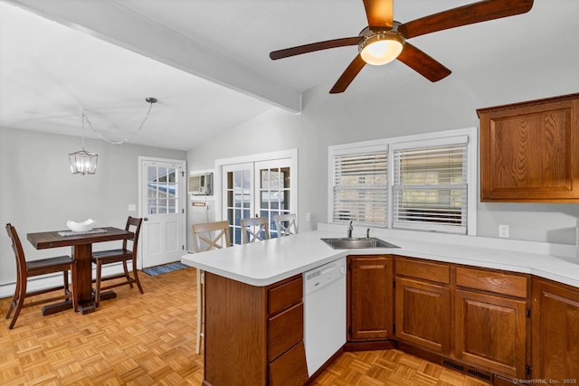 kitchen featuring visible vents, dishwasher, light countertops, lofted ceiling with beams, and a sink