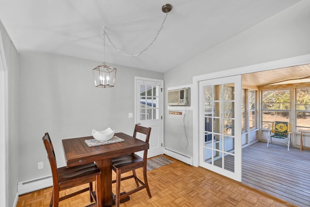 dining space featuring a chandelier, vaulted ceiling, a wall mounted AC, and a baseboard radiator