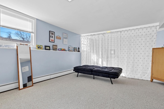 living area featuring baseboard heating, carpet, and a baseboard radiator