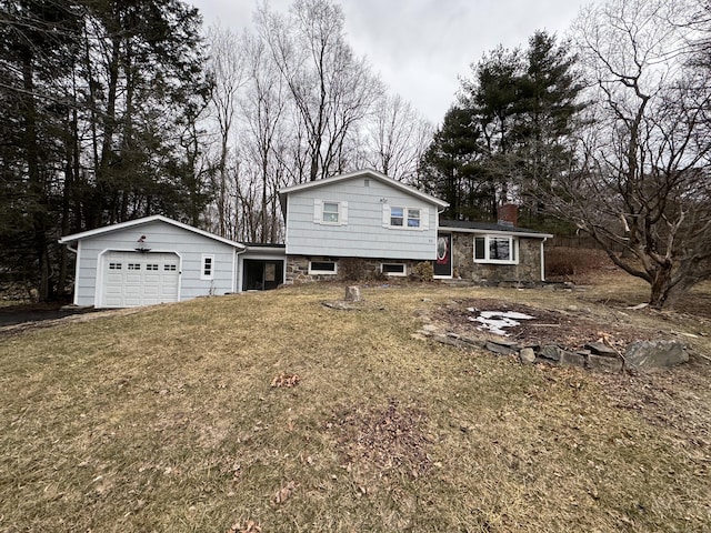 view of front of house featuring a garage, stone siding, a chimney, and a front yard