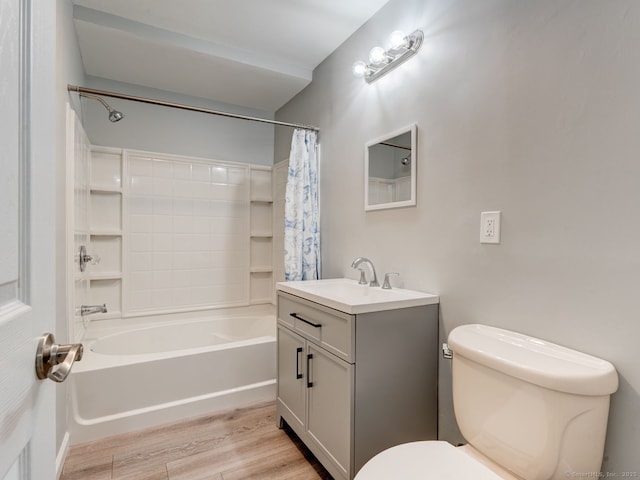 bathroom featuring shower / tub combo, toilet, wood finished floors, and vanity