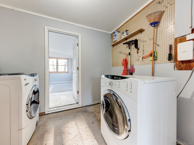 clothes washing area with laundry area, independent washer and dryer, and crown molding