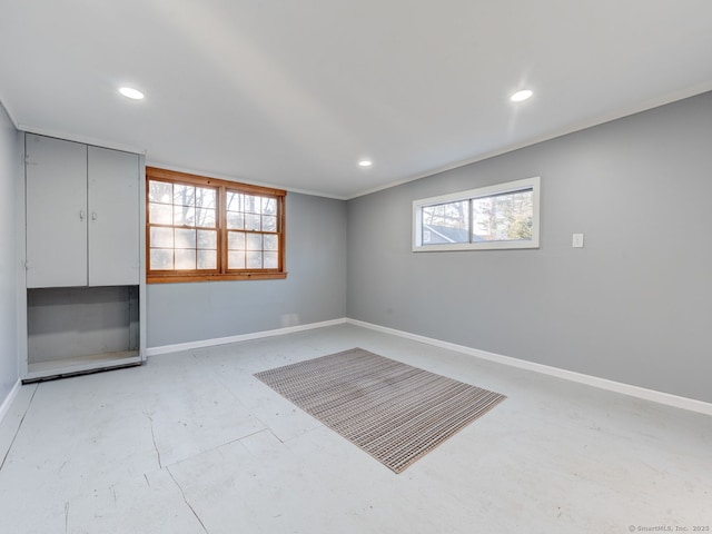 empty room with recessed lighting and baseboards