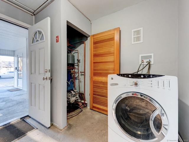 washroom featuring washer / clothes dryer and visible vents