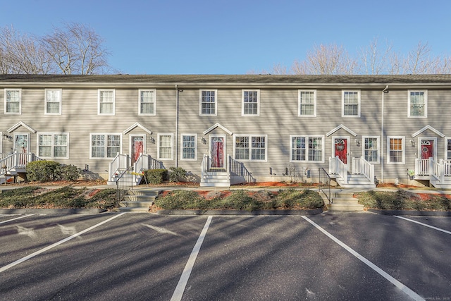 view of property with uncovered parking