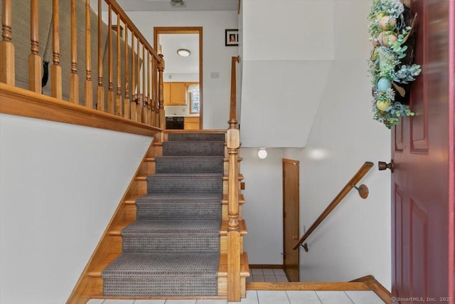 staircase featuring visible vents