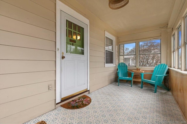 entrance to property featuring covered porch