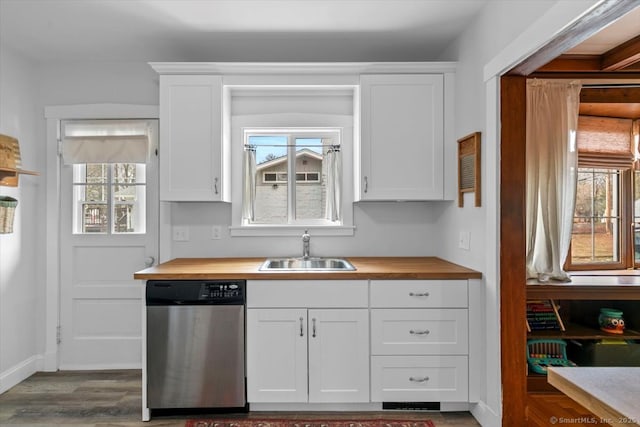 kitchen featuring white cabinetry, a sink, wood counters, wood finished floors, and dishwasher