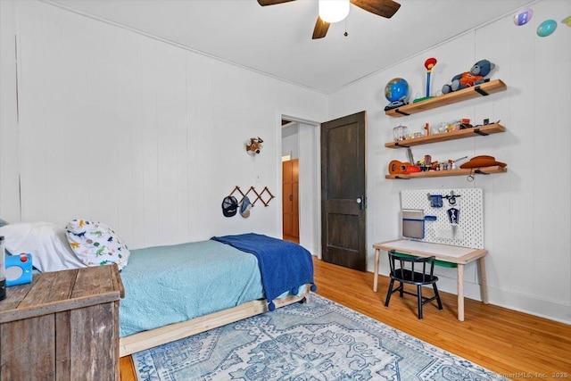 bedroom with ceiling fan and wood finished floors