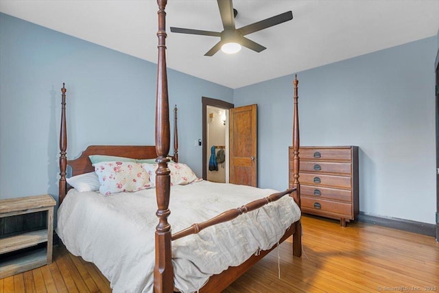 bedroom featuring light wood-type flooring and a ceiling fan