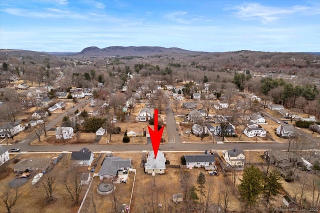 drone / aerial view with a residential view and a mountain view