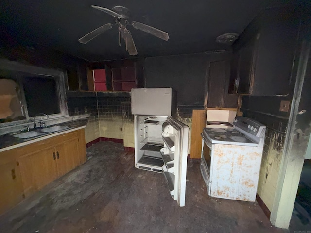 kitchen featuring washer / dryer, a ceiling fan, and a sink