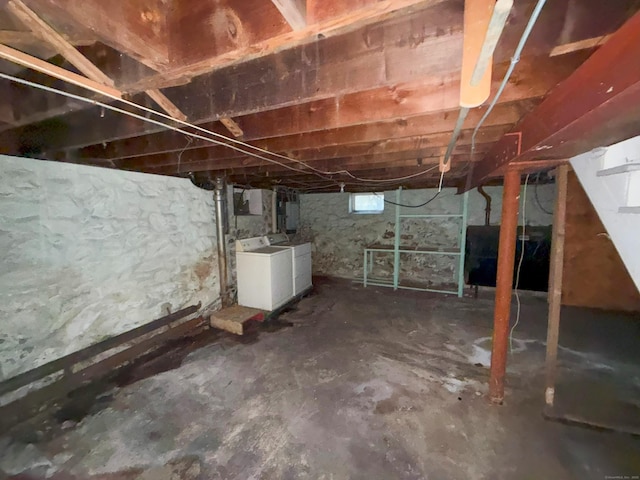 basement featuring heating fuel and separate washer and dryer