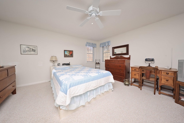 bedroom with carpet flooring, a ceiling fan, and baseboards