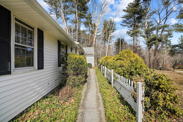 view of side of property with fence