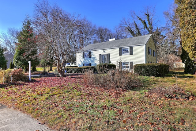 view of front of house featuring a chimney