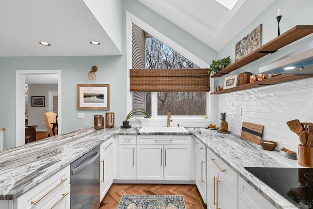 kitchen with light stone countertops, black electric cooktop, white cabinetry, open shelves, and stainless steel dishwasher